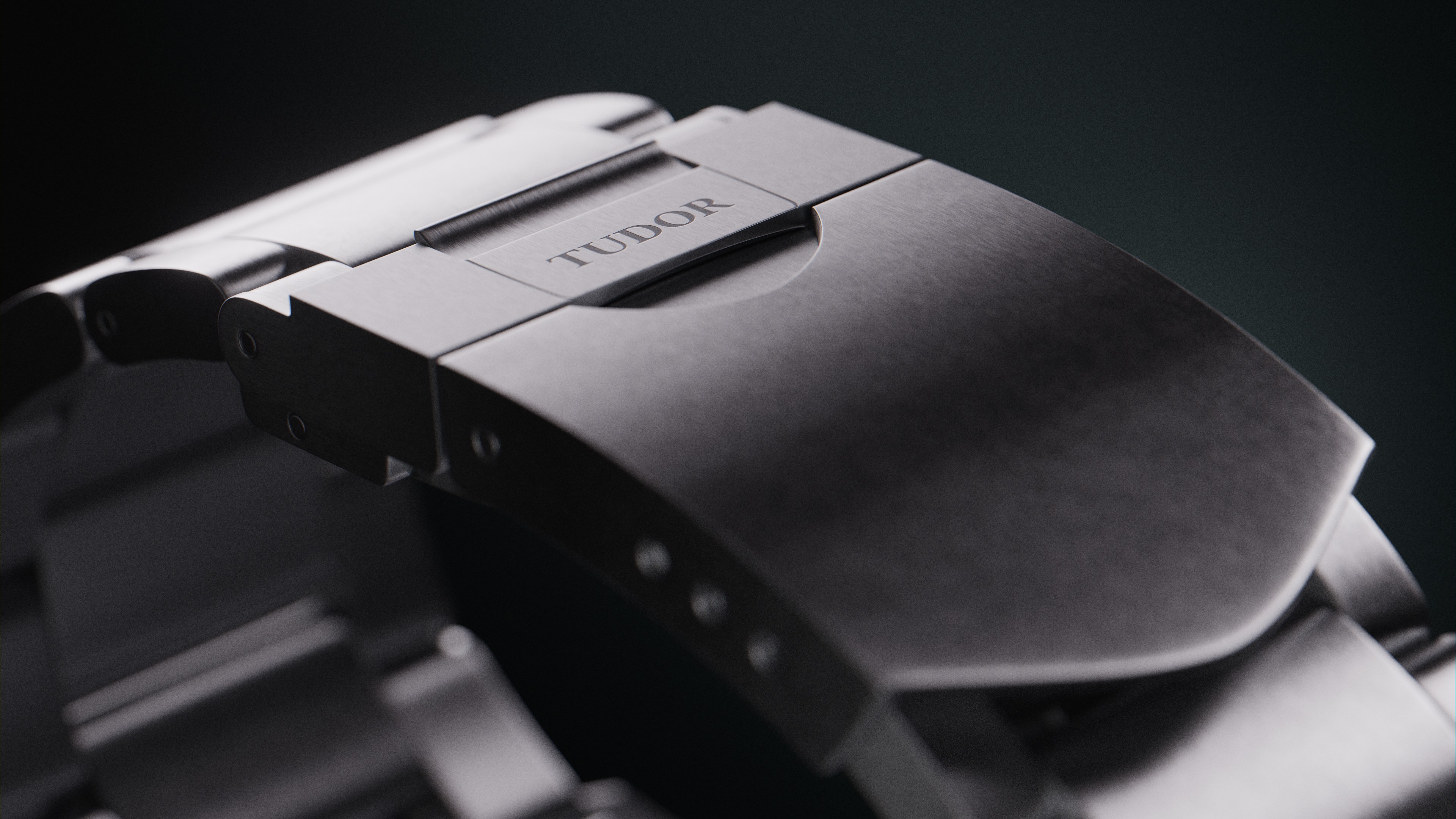 Frame from animated presentation of Tudor Heritage Ranger watch showcasing its rotating bezel and dynamic lighting effects. The animation highlights the watch's design features, including the brushed steel case, matte black dial, and luminous hour markers. The smooth rotation of the bezel and changing reflections emphasize the craftsmanship and robust construction of the timepiece.